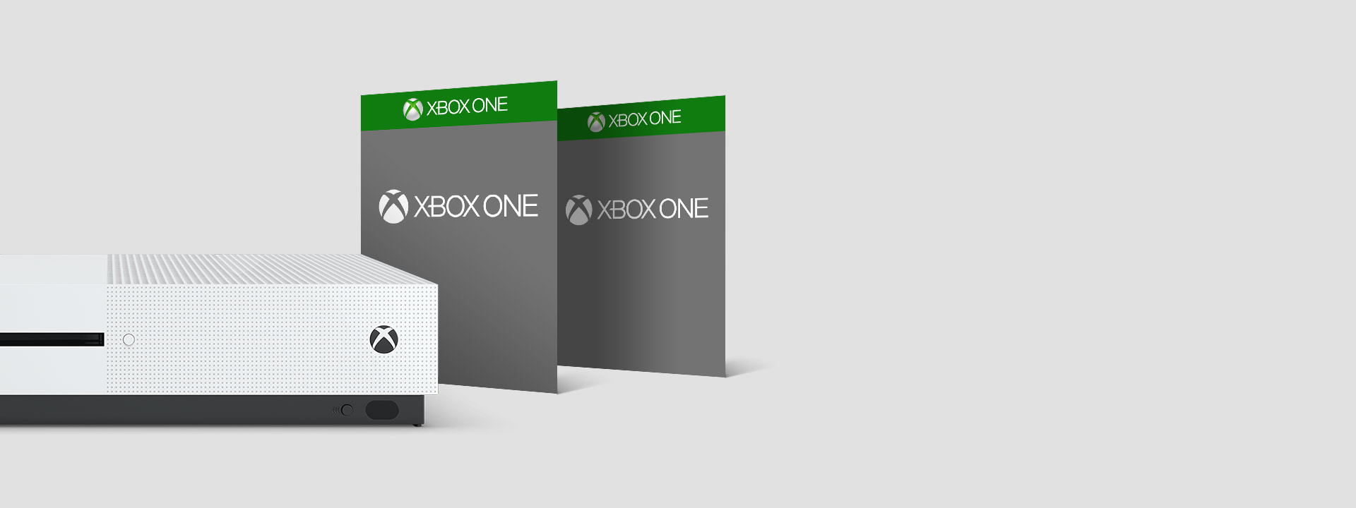 Xbox One 的正面视图，旁边有 2 款游戏