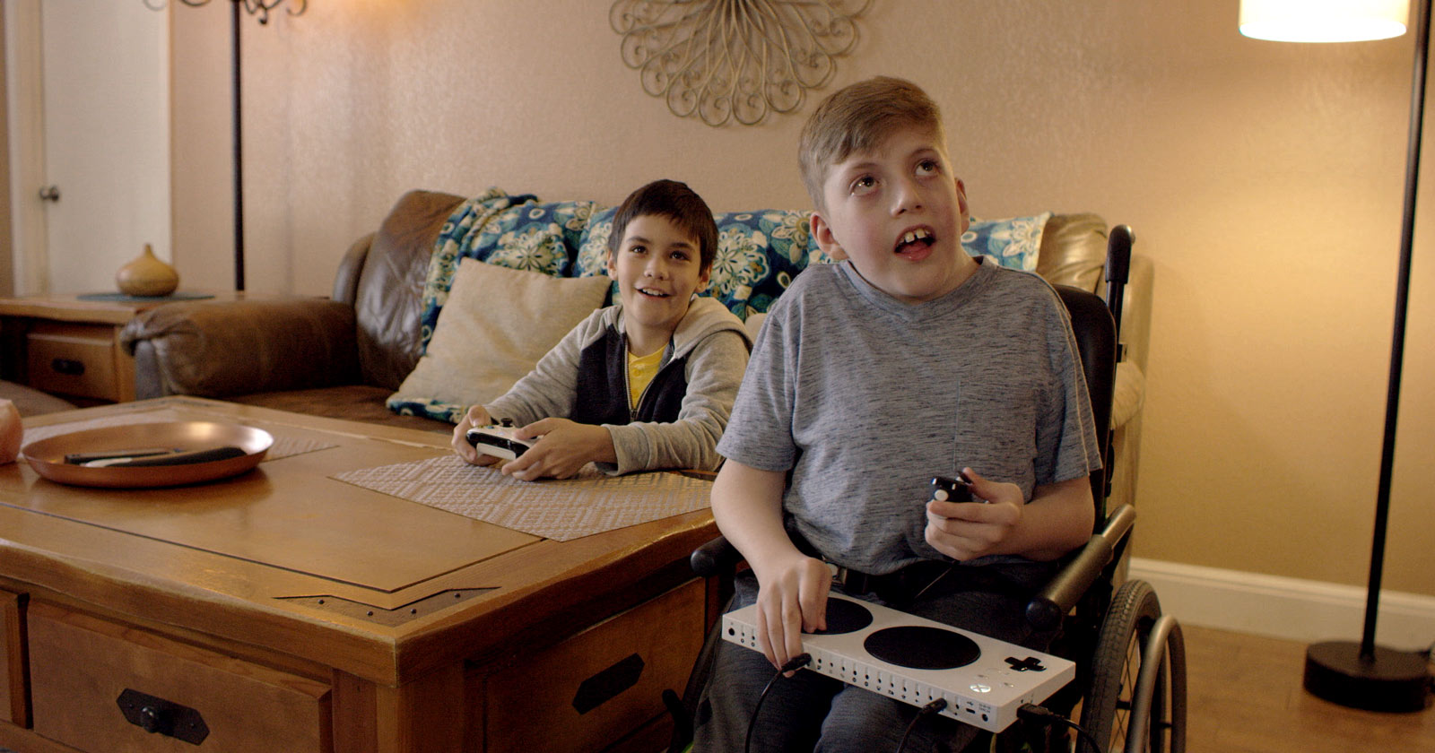 Owen using the Xbox Adaptive Controller with a friend holding an Xbox Wireless Controller