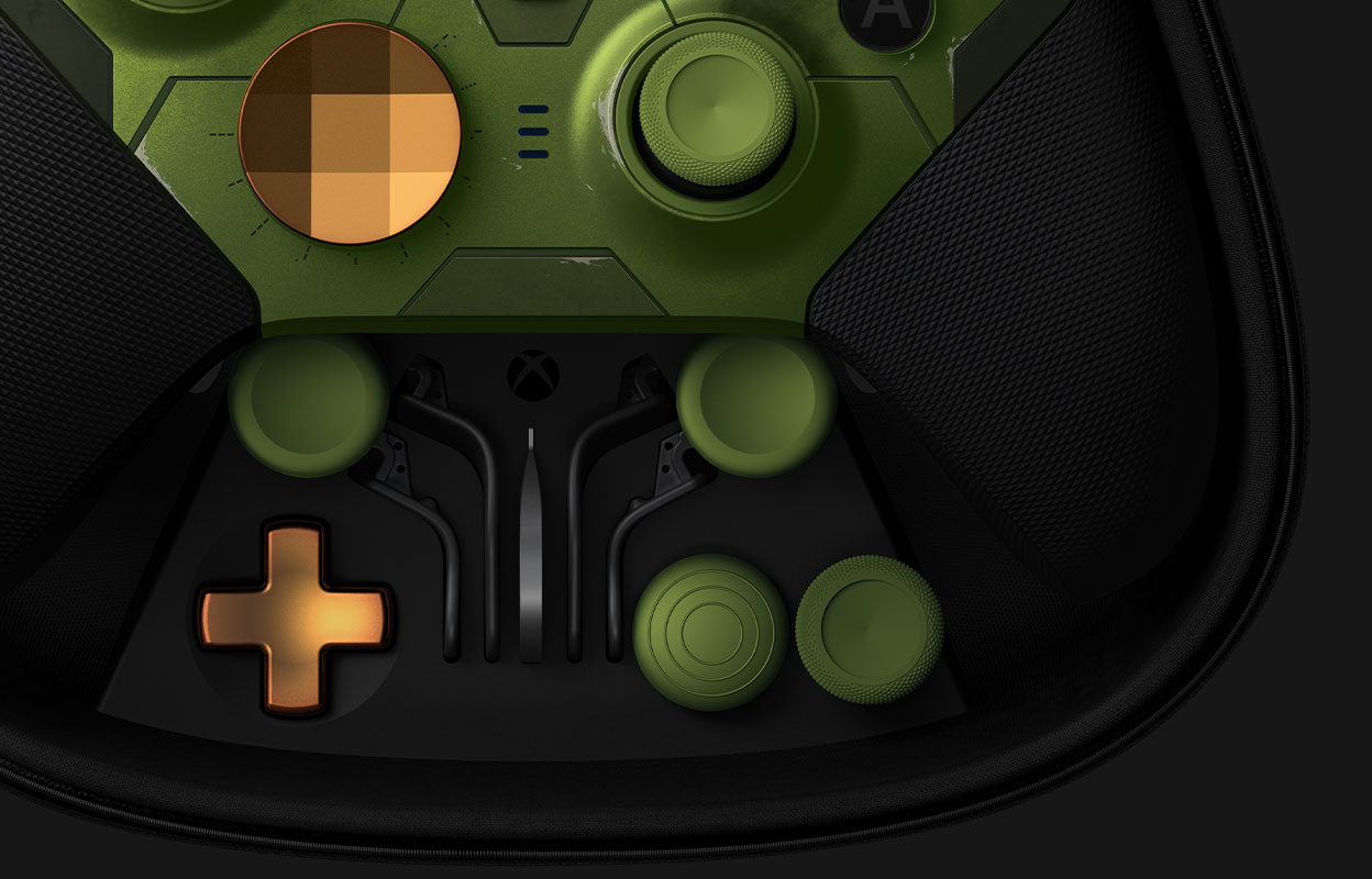 The bottom of the Elite series 2 Halo Infinite controller in the charging case with the interchangeable parts
