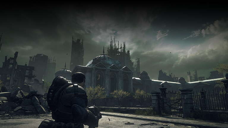 Marcus Fenix approaches ruins under a stormy sky. 